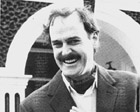 John Cleese as Basil Fawlty